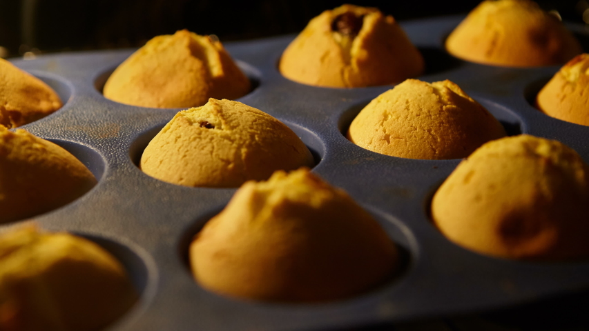 Muffins. Baking in oven. Time lapse footage of cooking Cupcakes, 4k, UHD