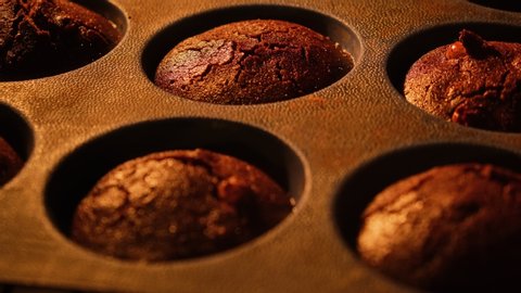 Muffins. Baking in oven. Time lapse footage of cooking Cupcakes, 4k, UHD. Cupcake. Growing muffins in oven