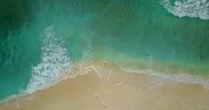 Top View Of Waves Break On Tropical White Sand Beach. Aerial Drone View 4K Shot