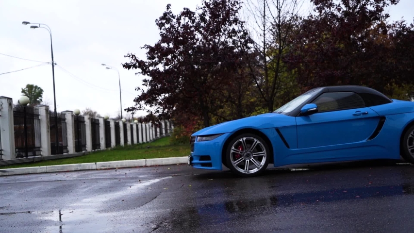 Moscow, Russia - 10 12 2019: New russian model car roadster crimea blue color on the street. Roadster Krim footage on the road. | Shutterstock HD Video #1039348478