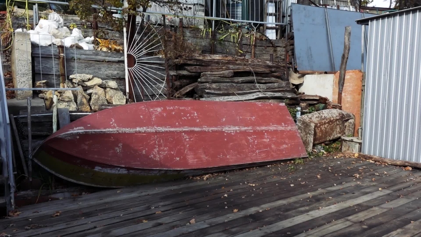 an old abandoned boat lying near the pier
