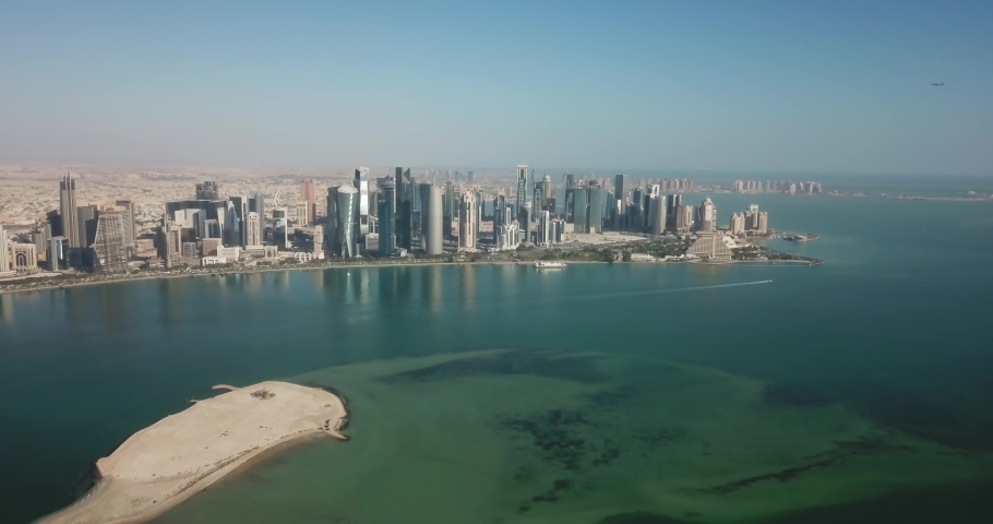Aerial view of Doha skyline and corniche, the business district of west bay with skyscrapers and buildings in Qatar, on the waterfront, futuristic city in middle east