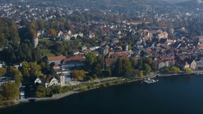 Aerial view of the city Überlingen beside the lake Constance in Germany on a sunny day in autumn, fall. Zoom in on the old town.