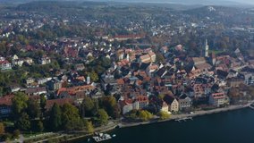 Aerial view of the city Überlingen beside the lake Constance in Germany on a sunny day in autumn, fall. Ascending beside the old town.