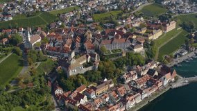 Aerial view of the city Meersburg beside the lake Constance in Germany on a sunny day in autumn, fall. Zoom out from the town.