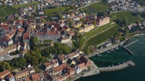 Aerial view of the city Meersburg beside the lake Constance in Germany on a sunny day in autumn, fall. Pan to the left across the town.