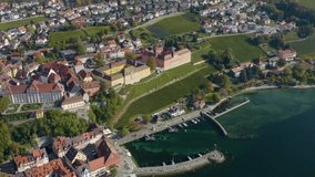 Aerial view of the city Meersburg beside the lake Constance in Germany on a sunny day in autumn, fall. Pan to the left beside the old town.