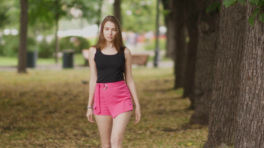 Young Elegant Woman Posing In The Park