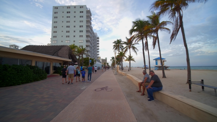 HOLLYWOOD, FL, USA - OCTOBER 19, 2019: Tourist season Hollywood Beach Florida gimbal stabilized footage 4k