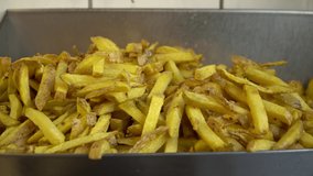Close up of french fries made of fresh potatoes - real time 4K video