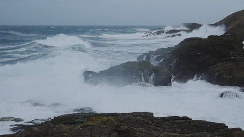 Dramatic Ocean Waves Crashing On Rocks At Calf Of Man, Isle Of Man. Slow Motion And Locked Off