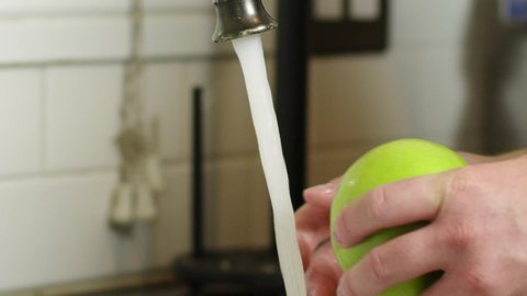 Washing an apple in 120fps close up