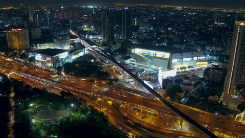 BANGKOK/THAILAND - 
OCTOBER 18: Aerial view of BTS Skytrain is crossing the Ladprao Intersection (Ha Yaek Ladprao) with road traffic with in the rush hour on 
October 18, 2019 in Bangkok, Thailand