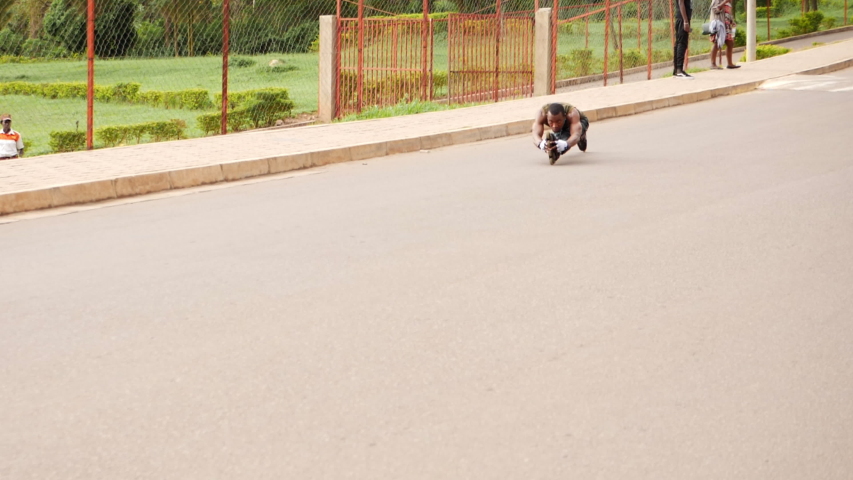 Super slow motion of  a young talented boy freestyling and running in the street 