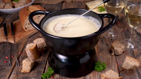 cheese fondue with wine and bread