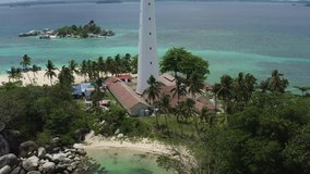 super close up shot of light house in lengkuas island of belitung indonesia. zoom in motion. drone forward flying