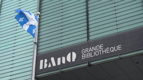 Montreal , Quebec / Canada - 10 02 2019: Montral, Quebec/Canada – October 2 2019: BANQ with Quebec flag in Montreal