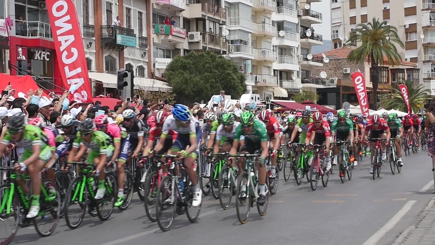 Bicycle Tour of Turkey, izmir, Turkey 2015. The peloton riding towards to the finish line.  Fans at the roadside are supporting the racers in the city center. 