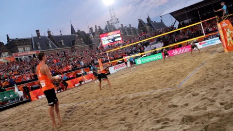 THE HAAG, NETHERLANDS - JULY 7th 2015: Brazilian beach volleyball players Alison Cerutti and Bruno Schmidt play against Dutch team during the World Cup Gold Final