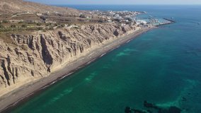 Aerial drone video of amazing shape giant volcanic rock formations in Vlychada beach, Santorini island, Cyclades, Greece
