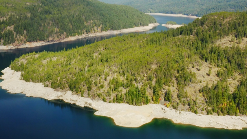 Nature in Washington State, a river between hills, Northeast of USA, travel around America, green forest and snowy mountain peaks.