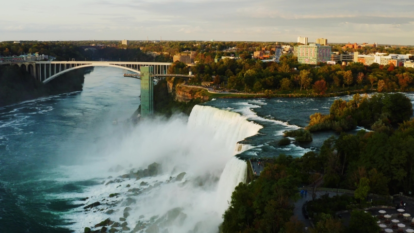 Buffalo, New York/USA - 09 17 2019: Bridges over Niagara Falls, sunset at famous destination of North America, nature of Northeast USA, fast water flow