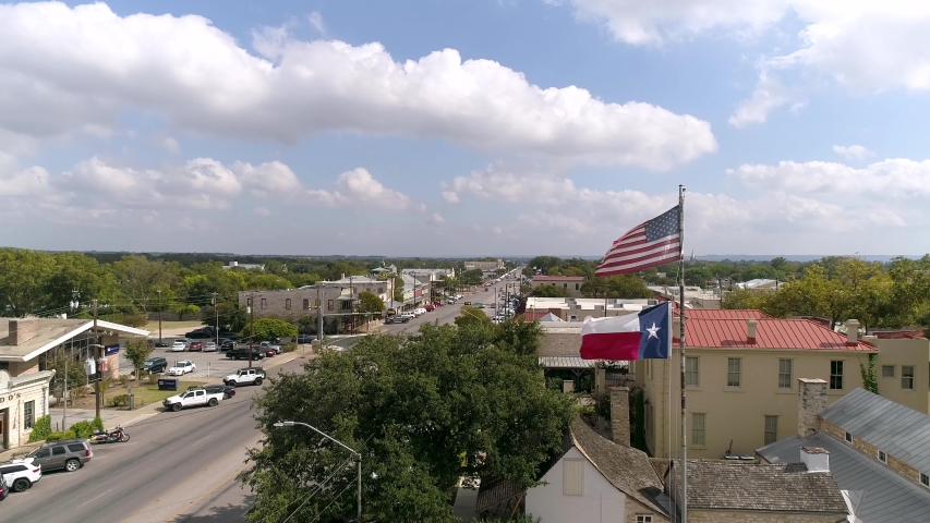 4K Slow Motion American Flag Texas Flag in Fredericksburg | Shutterstock HD Video #1039482002
