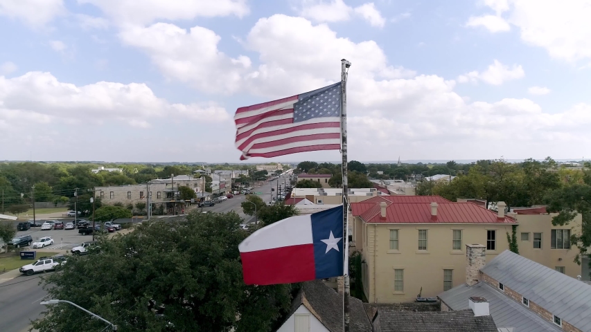 4K Dolly Right Texas Flag Fredericksburg Texas Slow Motion | Shutterstock HD Video #1039482053