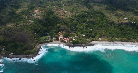 Montezuma, town in front of the sea, Costa Rica Pacific ocean, drone view