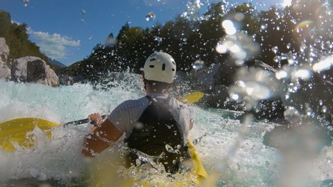 Slow-motion shot of two guys kayaking Arkivvideo