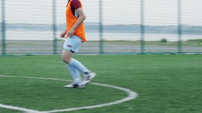 Female soccer player showing extra dribbling on summer arena, throwing ball and kicking it strongly - Powered by Shutterstock - Get 15% off with code: PIKWIZARD15
