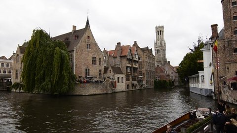 Bruges,Flanders region,Belgium.August 2019. In the charming old town, the Rozenhoedkaai is one of the major attractions. The canal that curves amidst historic houses, the weeping willow are fantastic.