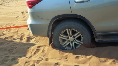 Car tire stuck in sand in africa offroad (Full HD)

