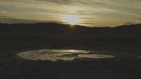 Sunset over volcanoes of mudd. Close up of a small volcano - Powered by Shutterstock - Get 15% off with code: PIKWIZARD15