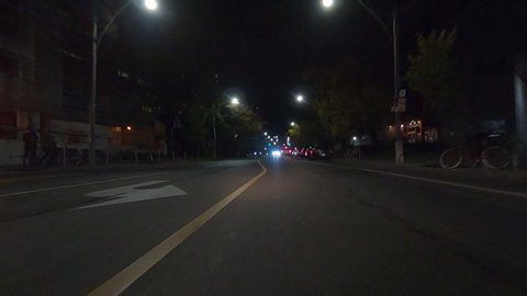 Toronto, Ontario, Canada October 21 2019 Driving plate POV forward low angle at night in downtown city streets 