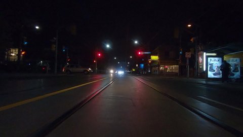 Toronto, Ontario, Canada October 21 2019 Driving plate POV forward low angle at night in downtown city streets 