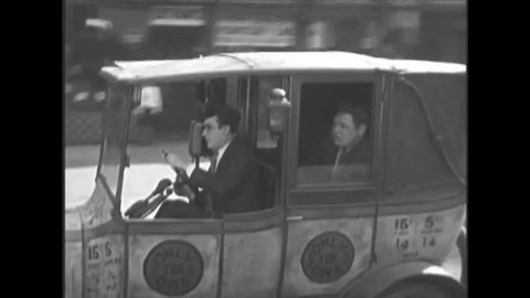 CIRCA 1920s - A reckless New York City taxi driver drives a customer in 1928