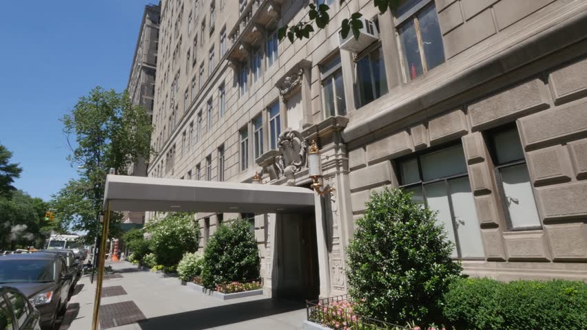 A typical daytime New York City apartment building establishing shot.