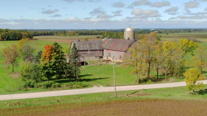 Wisconsin Autumn Colors With Scenic, Rustic Barn fly over.

