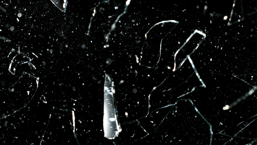 Real glass break in super slow motion shooted with high speed cinema camera at 2000 fps. Isolated on black.