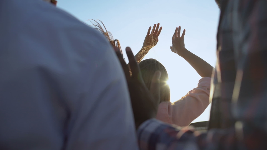 Young multiracial friends feeling rhythm of music, dancing at open air festival