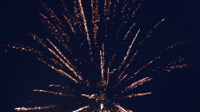 shining fireworks with bokeh lights in night sky. glowing fireworks show. New year's eve fireworks celebration. multico lored fireworks in night sky. beautiful colored night explosions in black sky Royalty-Free Stock Footage #1039558763