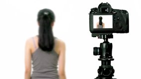 Teen girl stretching, seen through camera, vlogger concept