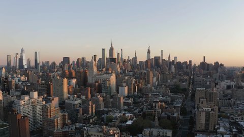 Aerial above Manhattan Midtown buildings, skyline panorama with skyscrapers on horizon, New York City