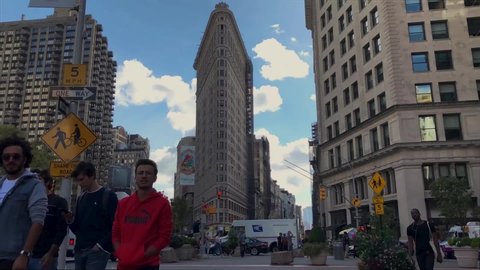 New York , New York / United States - 10 08 2019: Flatiron Building in New York City NYC, Iron District Fuller Building NY Time lapse