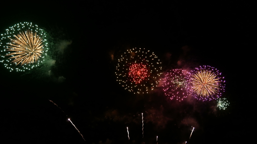 4K. long time seamless loop of real colorful fireworks festival in the sky display at night during national holiday, new year party or celebration event  | Shutterstock HD Video #1039570421