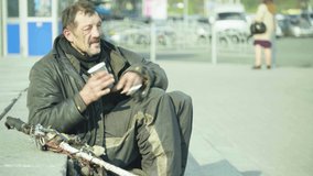 Beggar homeless man tramp. Poverty. Vagrancy. Kyiv. Ukraine.