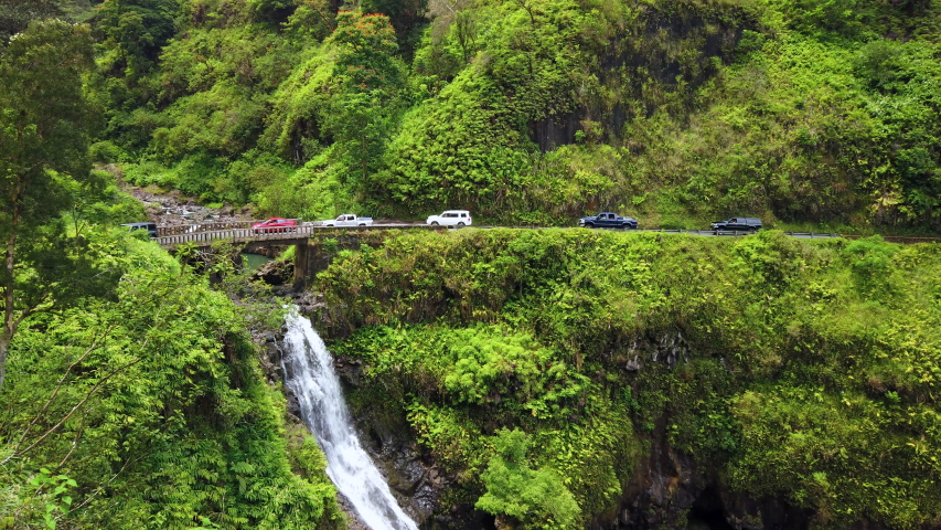Maui, Hawaii Hana Highway - Wailua Iki Falls (Wailuaiki). Road to Hana connects Kahului to the town of Hana Over 59 bridges, 620 curves, tropical rainforest Gimbal panning cinematic Rec.709 ProRes 422