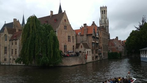 Bruges,Flanders region,Belgium.August 2019. In the charming old town, the Rozenhoedkaai is one of the major attractions. The canal that curves amidst historic houses, the weeping willow are fantastic.