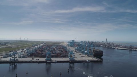Rotterdam, Holland. Aerial view of container terminal in the harbor MAASVLAKTE, Netherlands. A large containership is unloading